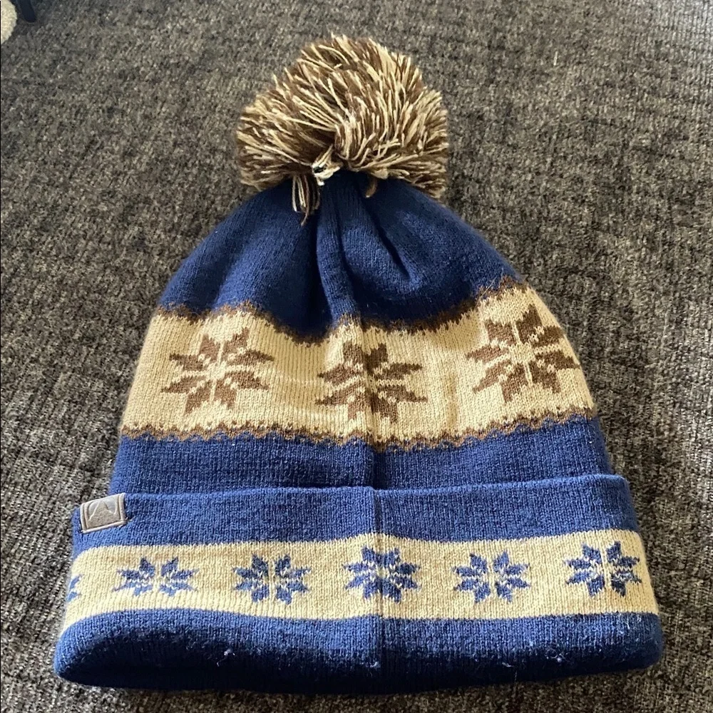 Cirque Blue and Tan Beanie with Colorado Patch. Designed in Vail, CO.